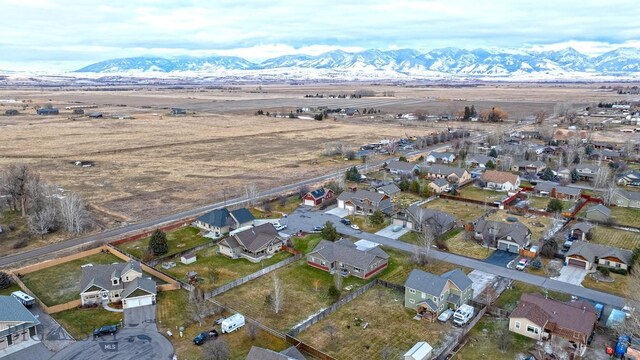 birds eye view of property featuring a mountain view