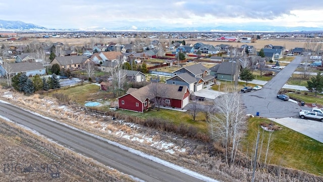 birds eye view of property with a mountain view