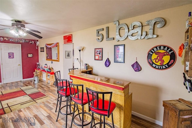 interior space featuring hardwood / wood-style floors and ceiling fan