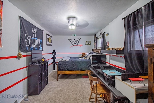 bedroom with carpet, a textured ceiling, and ceiling fan