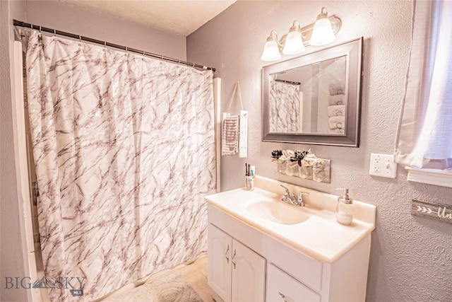 bathroom featuring vanity and walk in shower