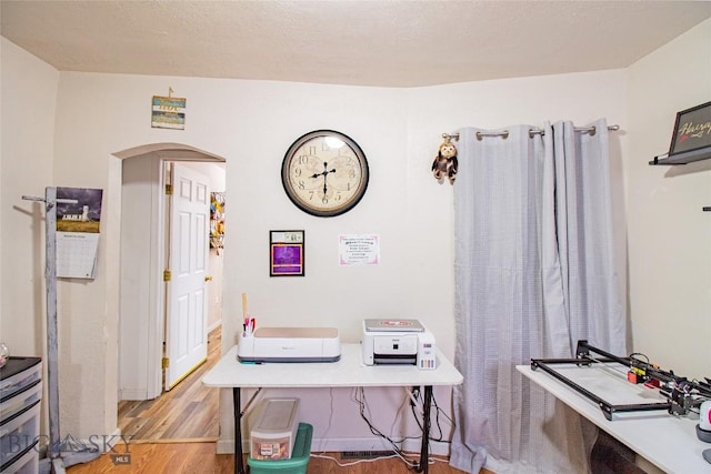 home office with light wood-type flooring