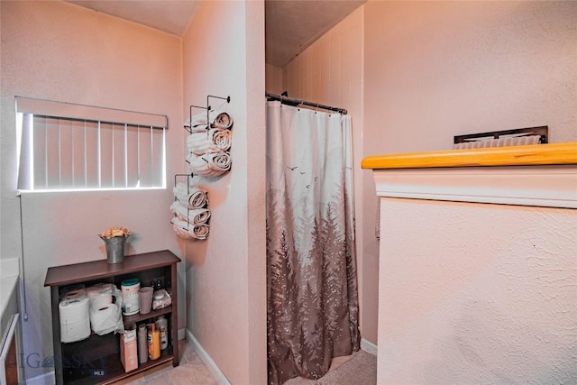 bathroom with a shower with curtain