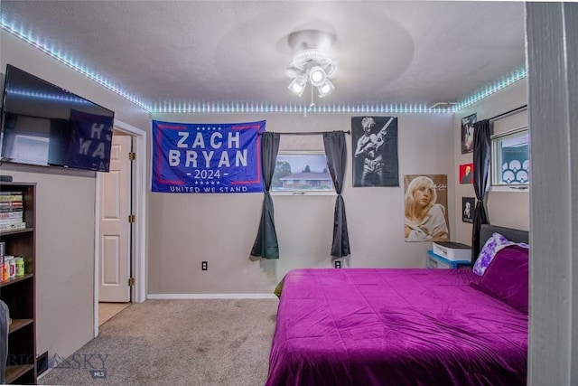 carpeted bedroom featuring ceiling fan