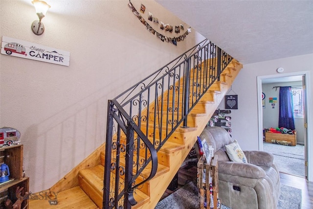 staircase featuring hardwood / wood-style flooring