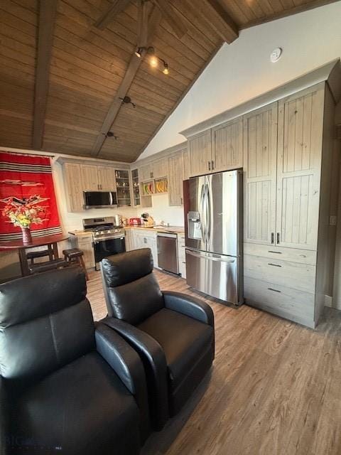 kitchen featuring lofted ceiling with beams, light brown cabinetry, wood-type flooring, stainless steel appliances, and wood ceiling