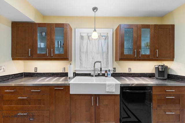 kitchen with dishwasher, hanging light fixtures, stainless steel counters, and sink