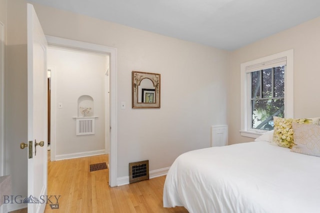 bedroom with light wood-type flooring