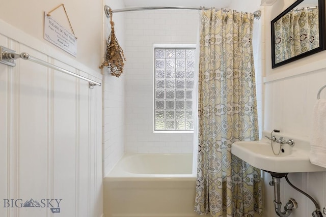 bathroom with shower / bath combination with curtain