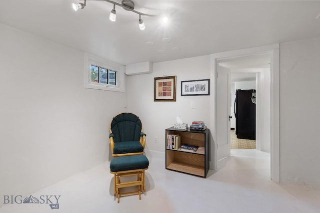 living area with concrete flooring