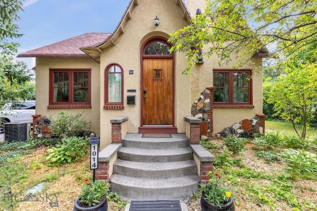 doorway to property with central air condition unit