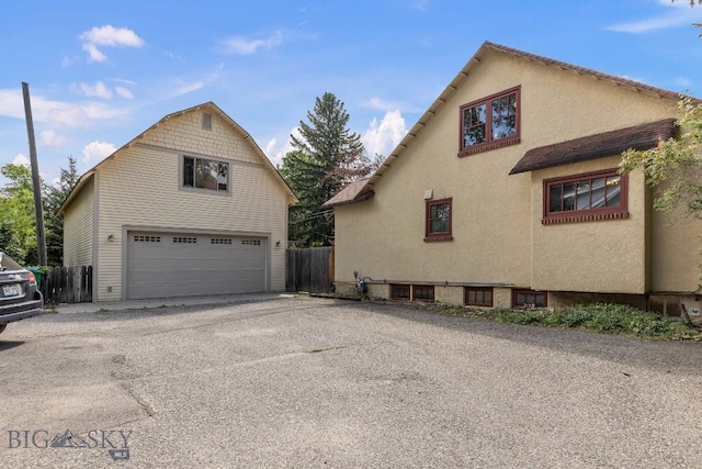 view of side of property with a garage