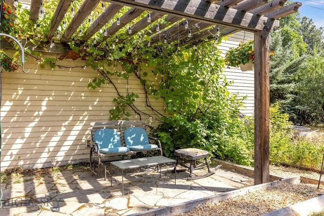 view of patio featuring a pergola