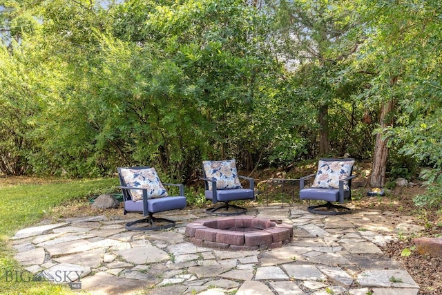 view of patio with an outdoor fire pit