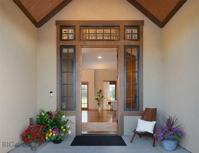 property entrance with stucco siding