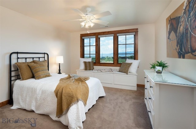 bedroom with a ceiling fan, light carpet, visible vents, and baseboards