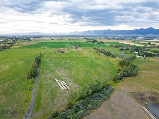 bird's eye view featuring a rural view and a mountain view