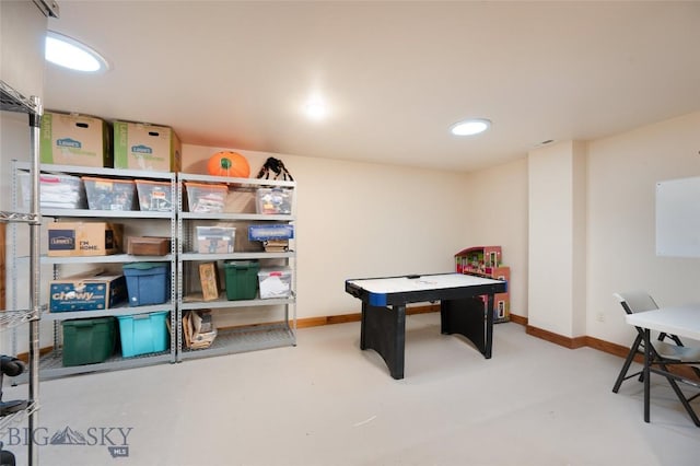 rec room with visible vents, concrete floors, and baseboards