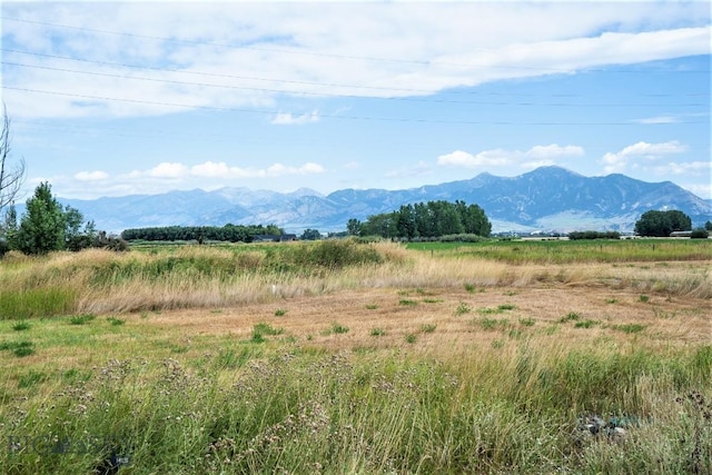 view of mountain feature with a rural view