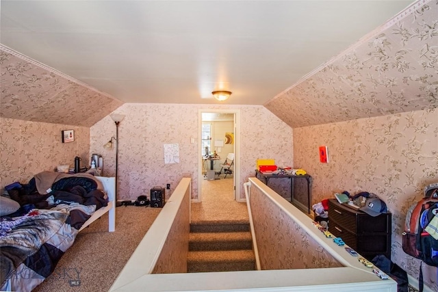 bedroom with lofted ceiling and carpet flooring