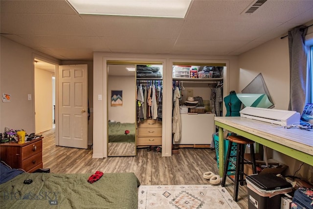 bedroom with hardwood / wood-style flooring