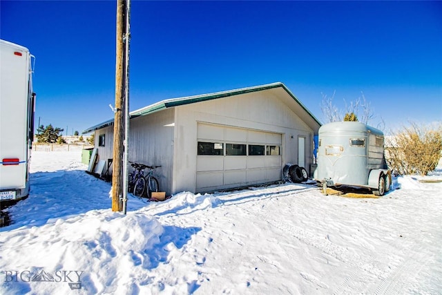 view of snow covered garage