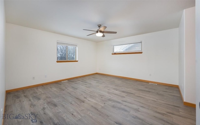 1121 Buckrake Ave, Bozeman, MT 59718 - empty room featuring baseboards, ceiling fan, and wood finished floors