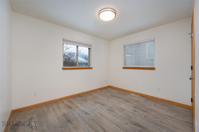 1121 Buckrake Ave, Bozeman, MT 59718 - empty room featuring wood finished floors and baseboards