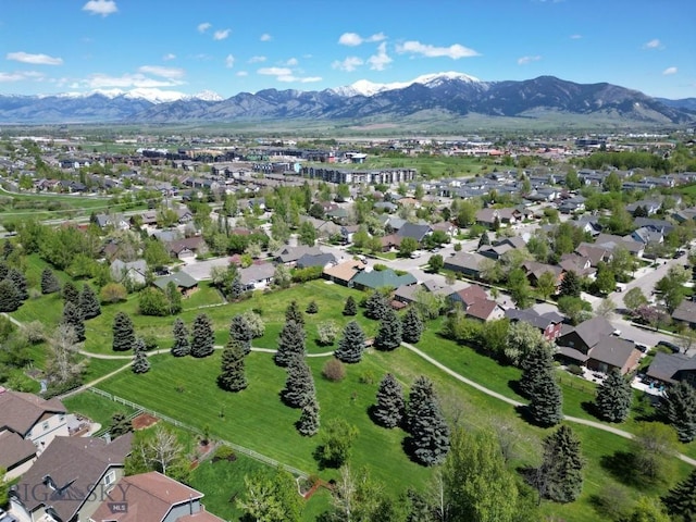 1121 Buckrake Ave, Bozeman, MT 59718 - aerial view of property and surrounding area featuring mountains and nearby suburban area