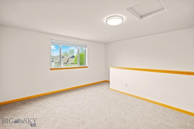 1121 Buckrake Ave, Bozeman, MT 59718 - unfurnished room featuring baseboards, attic access, and carpet