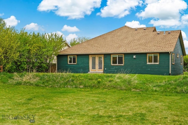 1121 Buckrake Ave, Bozeman, MT 59718 - back of property with a yard, french doors, and a shingled roof