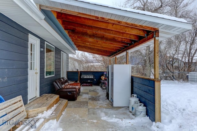 view of snow covered patio