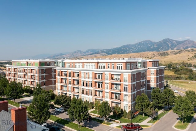 view of building exterior featuring a mountain view