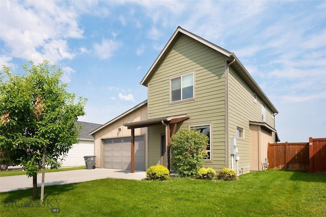 view of property with a garage and a front yard