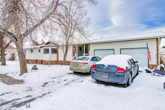 ranch-style house featuring a garage