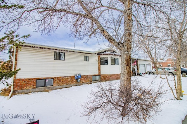 view of snow covered house