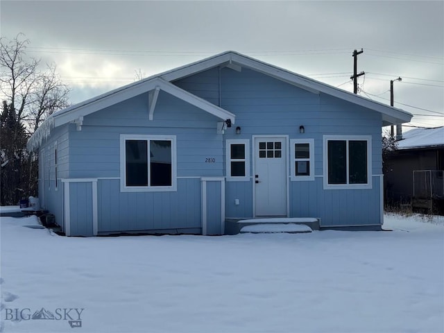 view of snow covered property