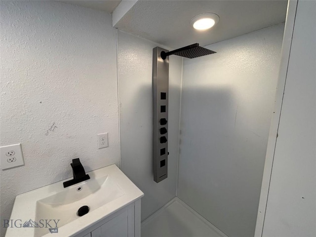 bathroom with sink and walk in shower