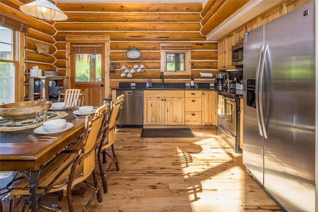 kitchen with log walls, stainless steel appliances, light brown cabinetry, light hardwood / wood-style floors, and sink