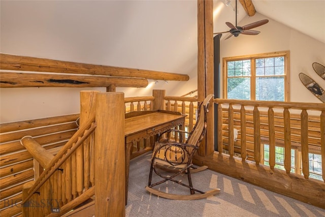 sitting room with ceiling fan, vaulted ceiling with beams, and carpet flooring