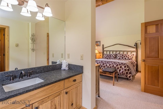 bathroom featuring vanity and beam ceiling