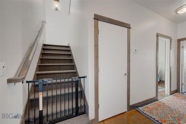 stairs featuring concrete floors