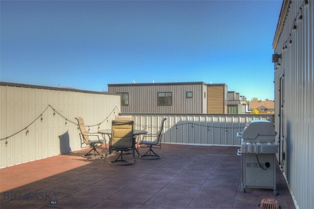 view of patio with a grill