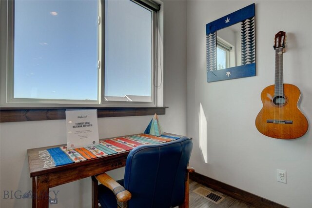 office area with wood-type flooring