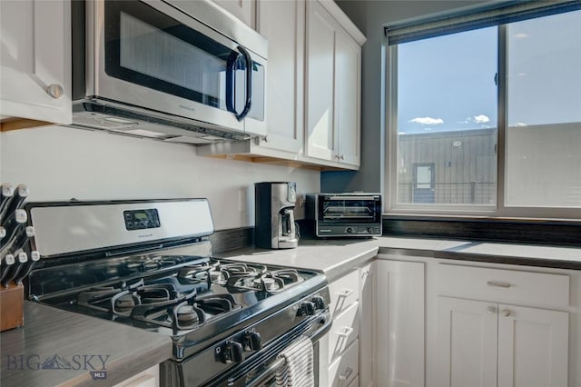 kitchen with white cabinets and stainless steel appliances