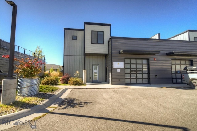 exterior space with driveway and an attached garage