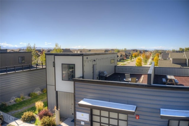 back of property with fence and a residential view