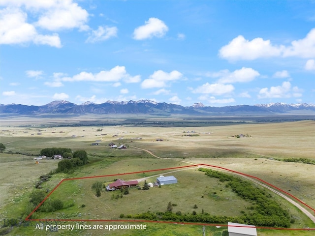 birds eye view of property featuring a mountain view and a rural view