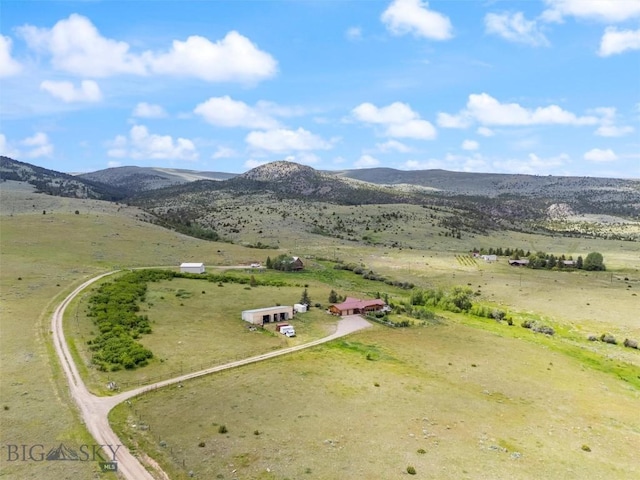 birds eye view of property featuring a mountain view and a rural view