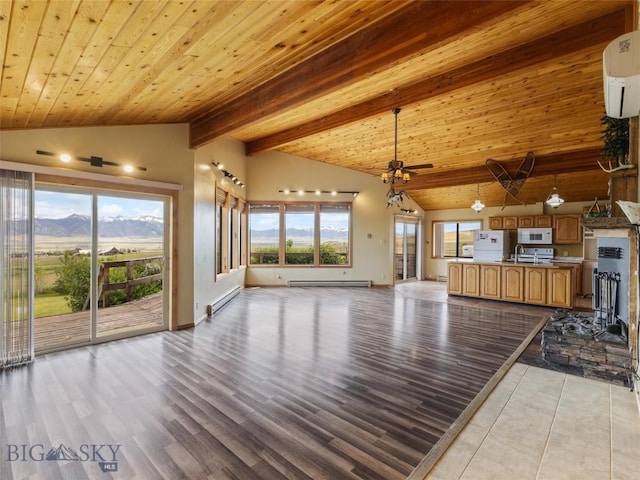 unfurnished living room featuring baseboard heating, a mountain view, light hardwood / wood-style flooring, and wood ceiling